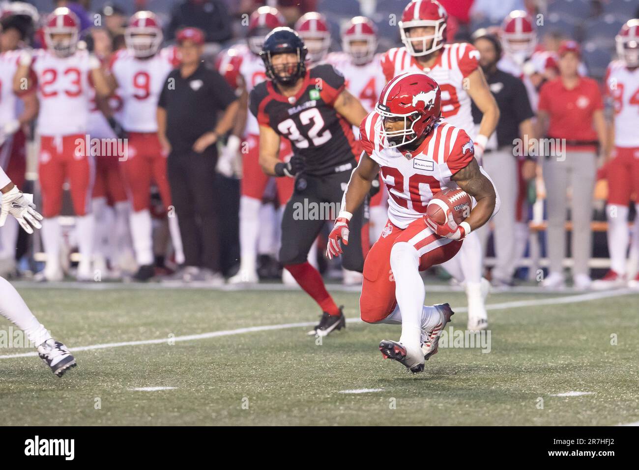 Ottawa, Canada. 15th June, 2023. Calgary Stampeders running back Peyton Logan (20) returns a kick during the CFL game between Calgary Stampeders and Ottawa Redblacks held at TD Place Stadium in Ottawa, Canada. Daniel Lea/CSM/Alamy Live News Stock Photo