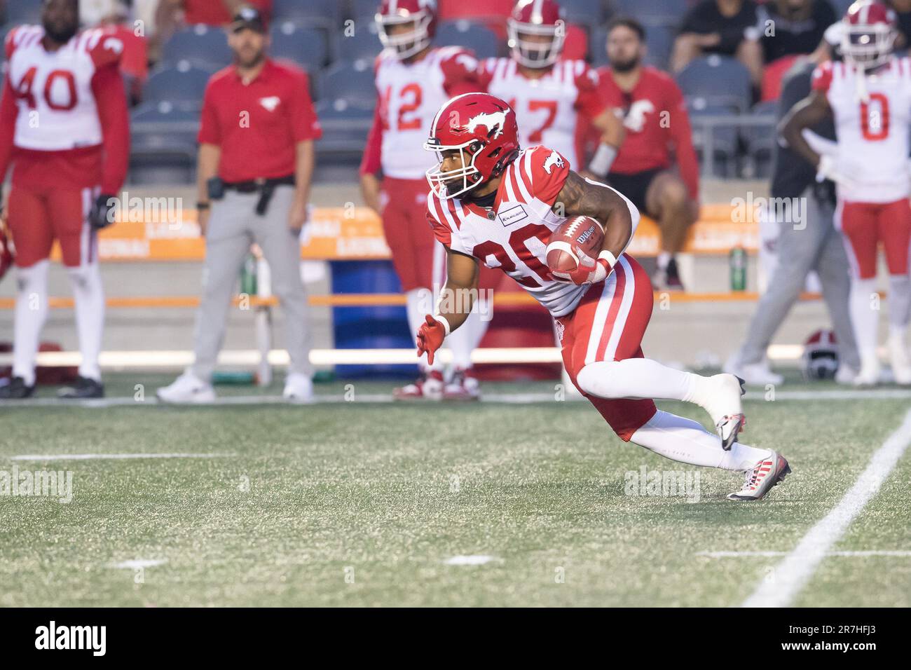 Ottawa, Canada. 15th June, 2023. Calgary Stampeders running back Peyton Logan (20) returns a kick during the CFL game between Calgary Stampeders and Ottawa Redblacks held at TD Place Stadium in Ottawa, Canada. Daniel Lea/CSM/Alamy Live News Stock Photo