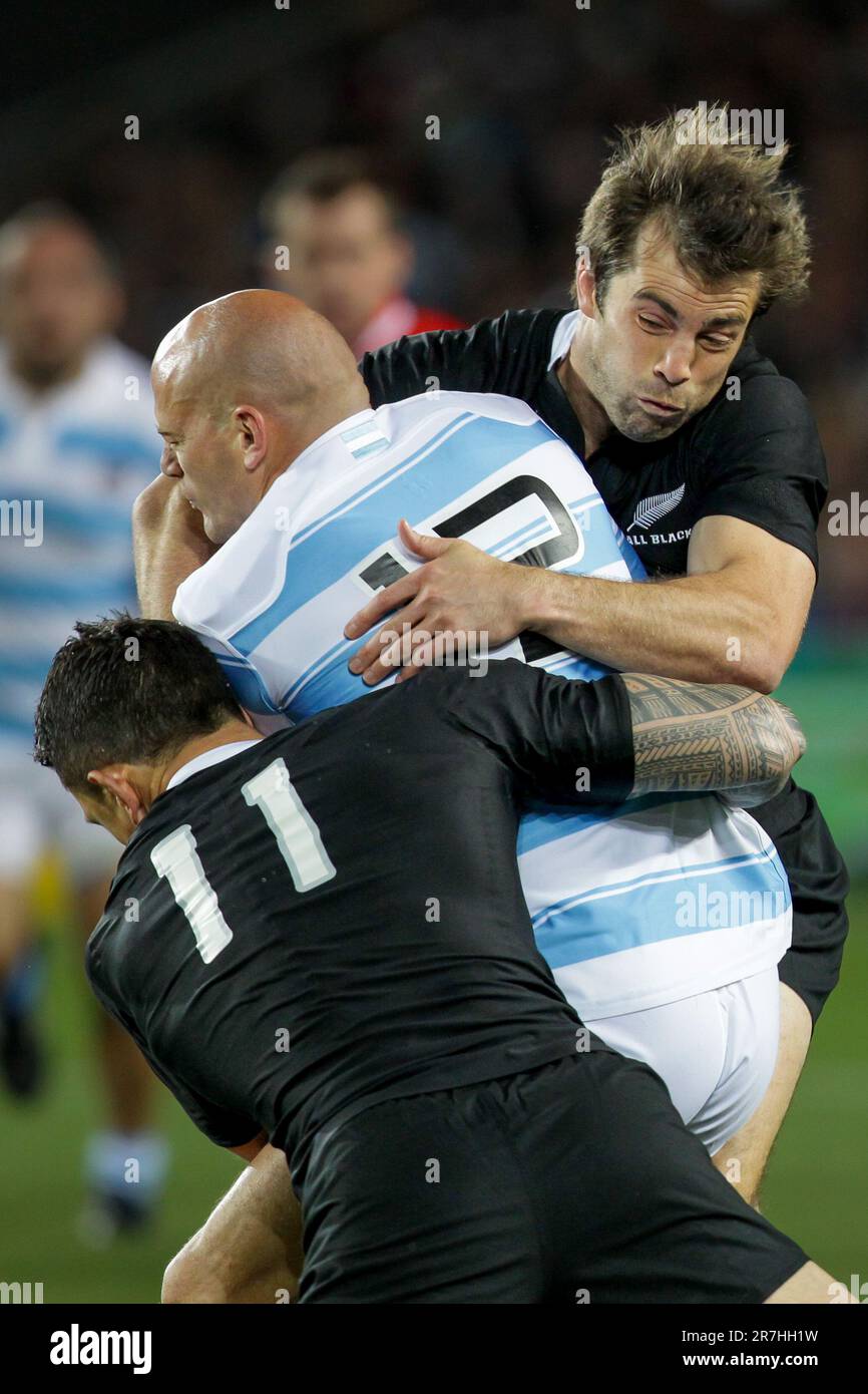 New Zealand’s Conrad Smith and Sonny Bill Williams tackle Argentina’s captain Felipe Contepomi during quarter-final 4 match of the Rugby World Cup 2011, Eden Park, Auckland, New Zealand, Sunday, October 09, 2011. Stock Photo