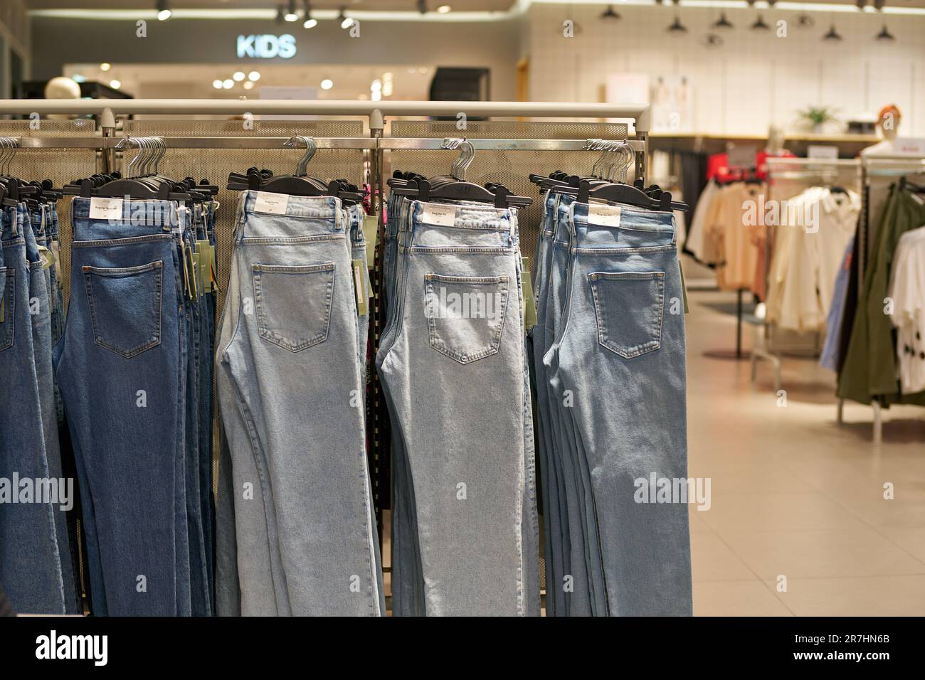 PATTAYA, THAILAND - CIRCA APRIL, 2023: jeans displayed at H and M retail  store. H and M focuses on fast-fashion clothing for men, women, teenagers,  an Stock Photo - Alamy
