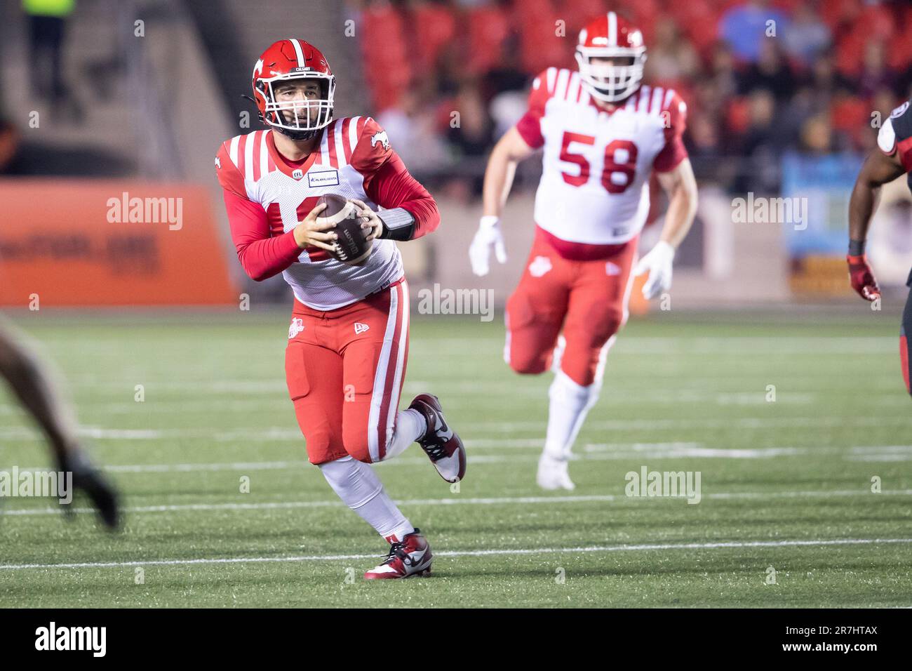 Ottawa, Canada. 15th June, 2023. Calgary Stampeders quarterback Jake Maier (12) runs with the ball during the CFL game between Calgary Stampeders and Ottawa Redblacks held at TD Place Stadium in Ottawa, Canada. Daniel Lea/CSM/Alamy Live News Stock Photo