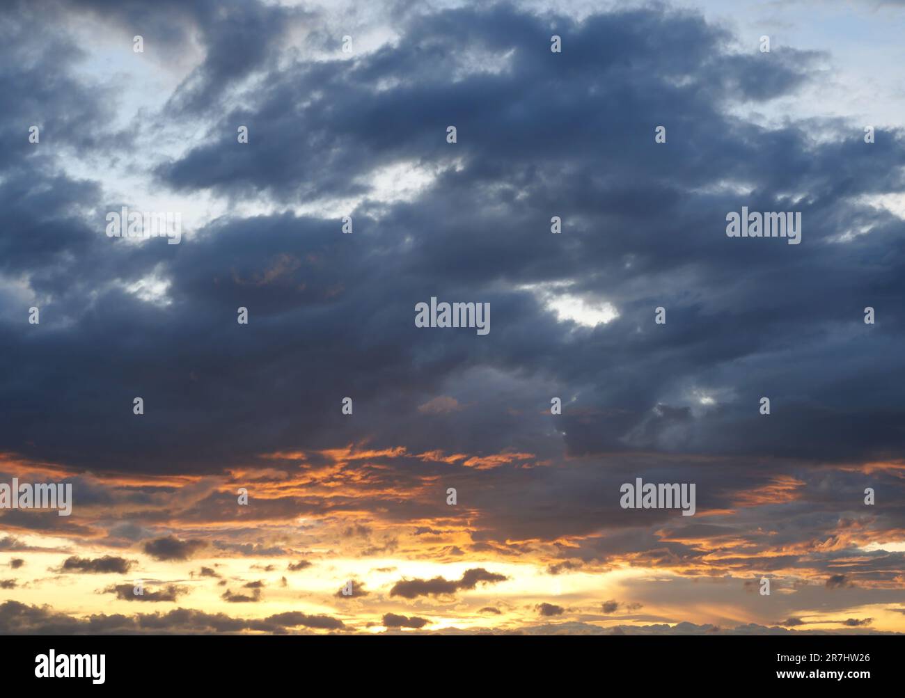 Cloud and blue sky in magic hour at sunset, The horizon began to turn orange with purple cloud at night, Dramatic cloudscape area Stock Photo