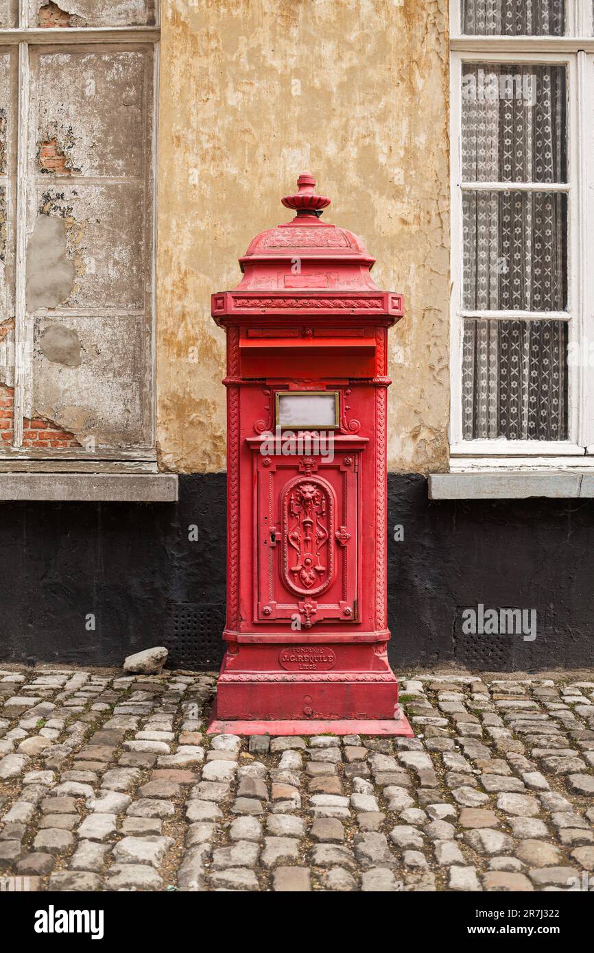 A vertical of a vintage red mailbox located in Lier, Belgium Stock Photo