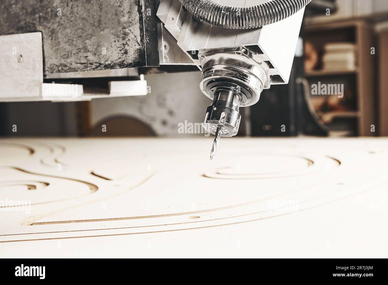 Numerically controlled woodworking machine cuts rounded complex lines