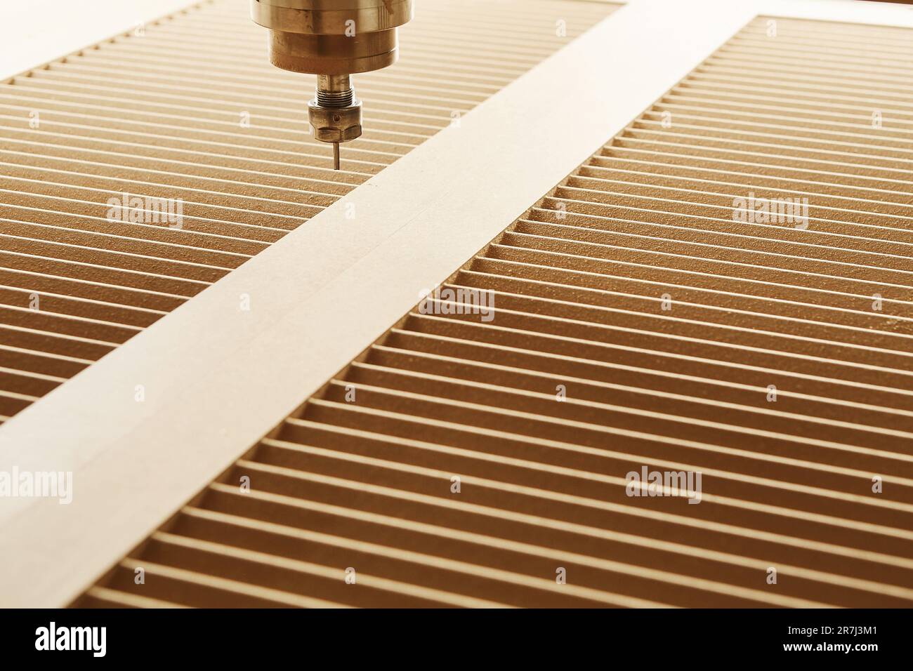 Cnc machine at carpentry workshop. Cutting wood with various router ...