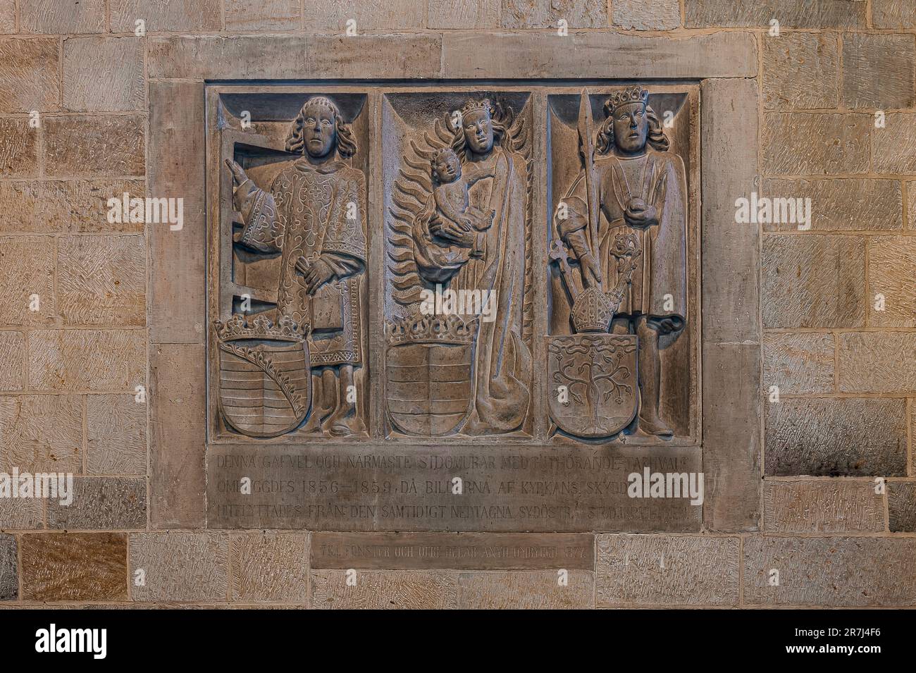 reliefs of the three patron saints of Lund cathedral, St. Lawrence, Virgin Mary, st. Canute, Lund.Sweden, May 22, 2023 Stock Photo