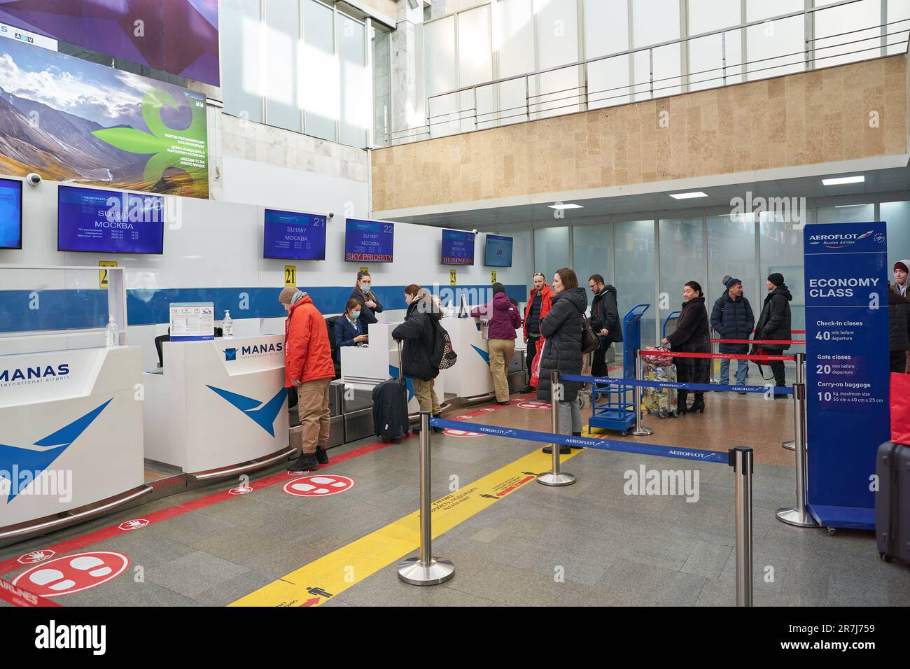 BISHKEK, KYRGYZSTAN - CIRCA JANUARY, 2023: people stand in queue at ...