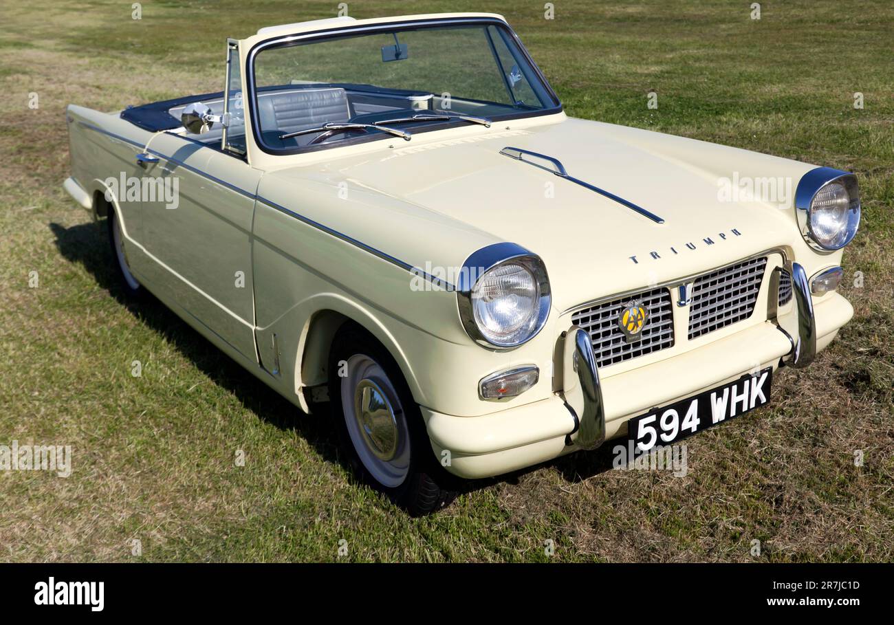 Threequarters front view of a Cream, 1961, Triumph Herald Convertible