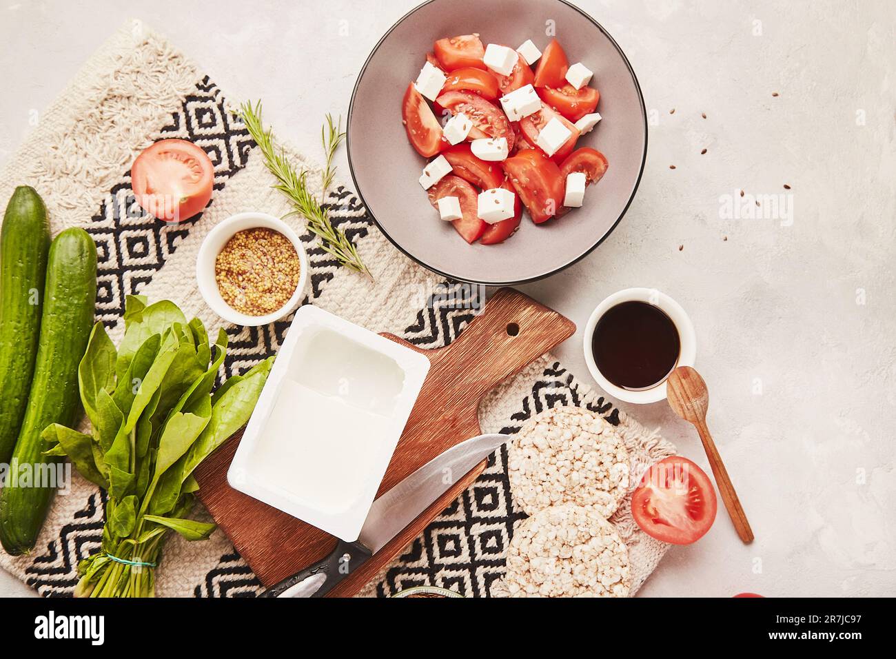 Seasonal ingredients for healthy low fodmap, Mediterranean diet with vegetables, fruits, greens, salad with feta. Flat lay, copy space. Stock Photo