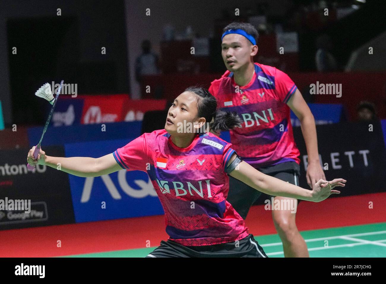 Indonesias Pitha Haningtyas Mentari, left, with Rinov Rivaldy plays against Japans Yuta Watanabe and Arisa Higashino during their mixed doubles quarter final match at Indonesia Open badminton tournament at Istora Stadium in