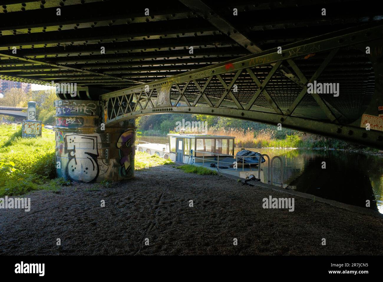 Underneath Bow railway bridge on the river Lee, near Stratford, London Stock Photo