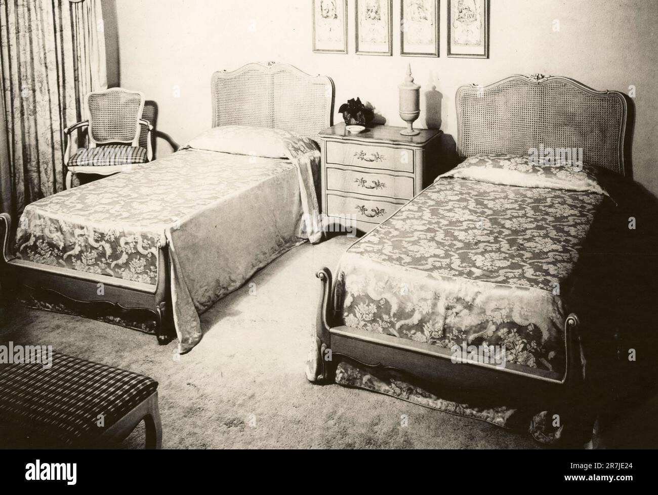 Bedroom composed of single and large beds and bedside table, Italy 1970s Stock Photo