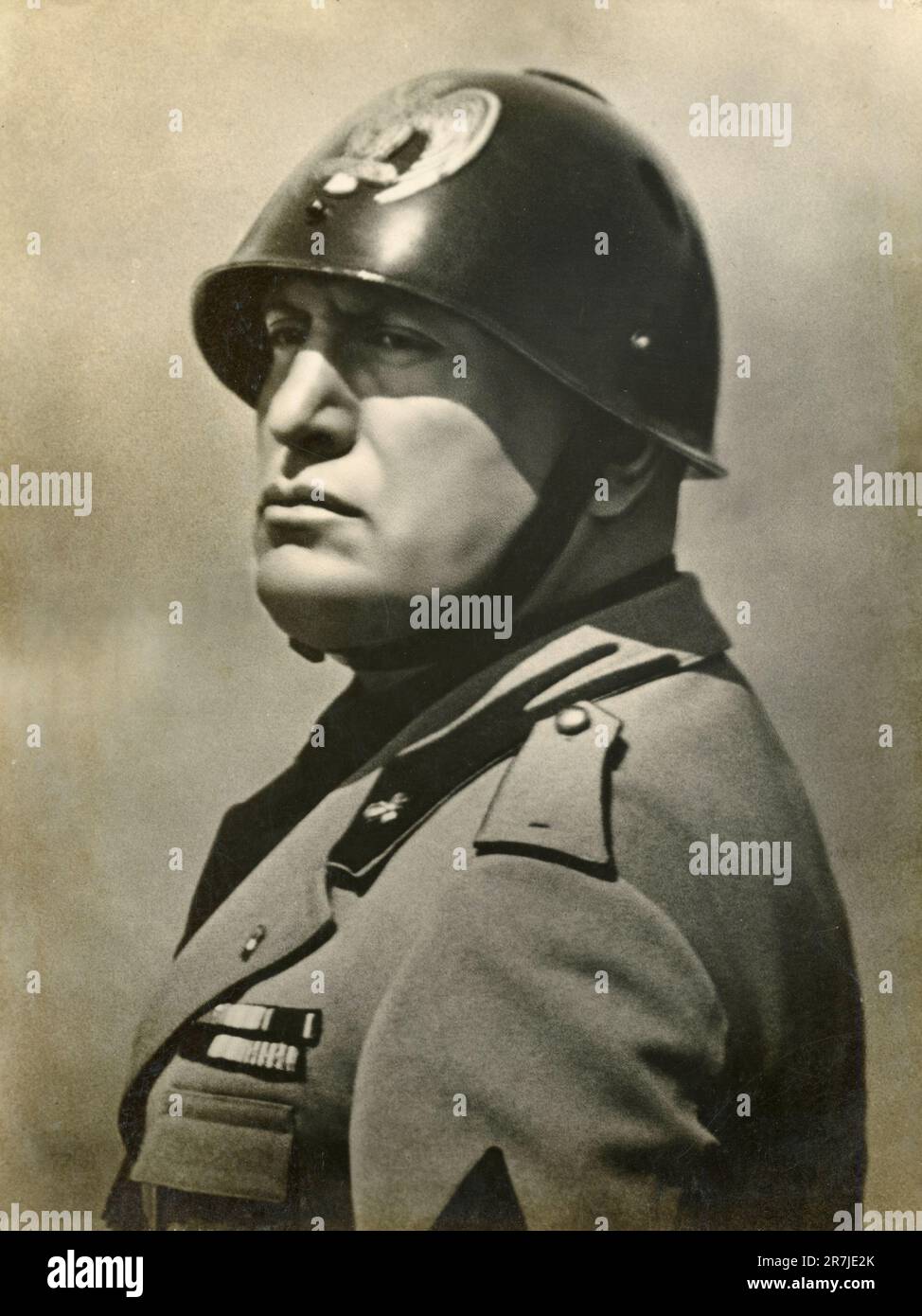Portrait of Italian journalist, politician and dictator Benito Mussolini wearing helmet and uniform, Italy 1930s Stock Photo