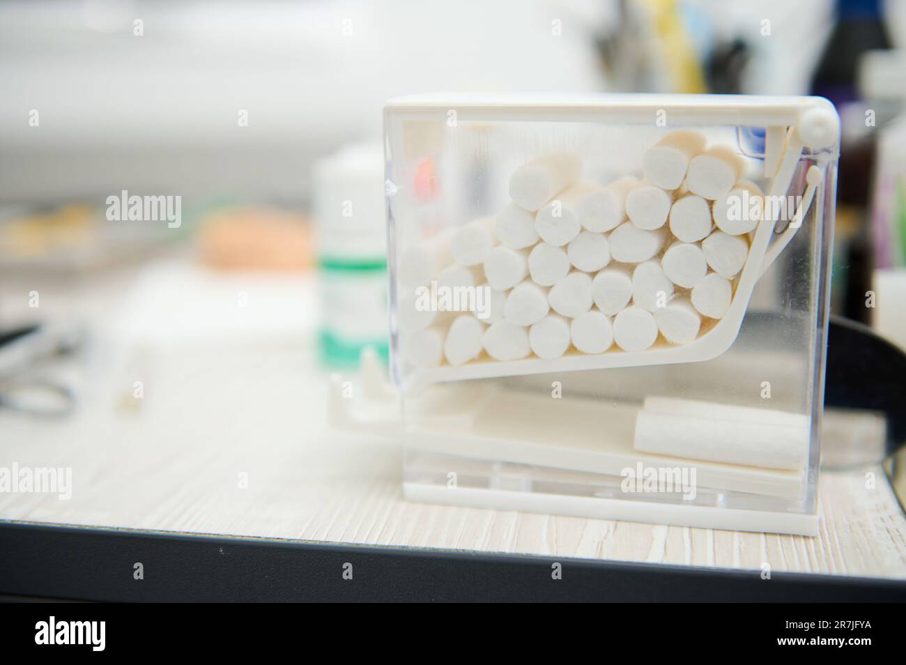 Cotton swabs inside a transparent container in the dental clinic Stock