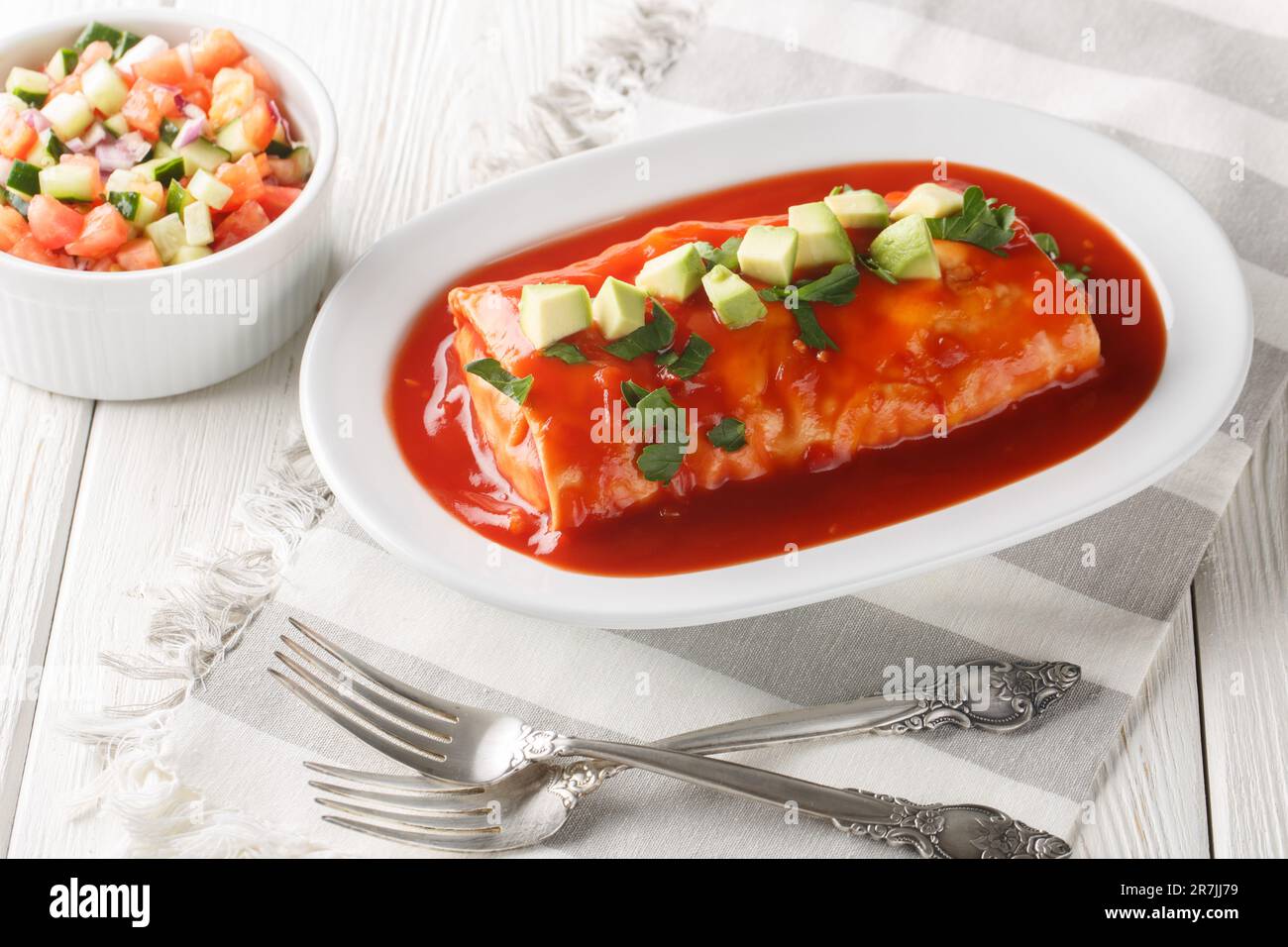 Wet burrito recipe made with flour tortillas filled with ground beef