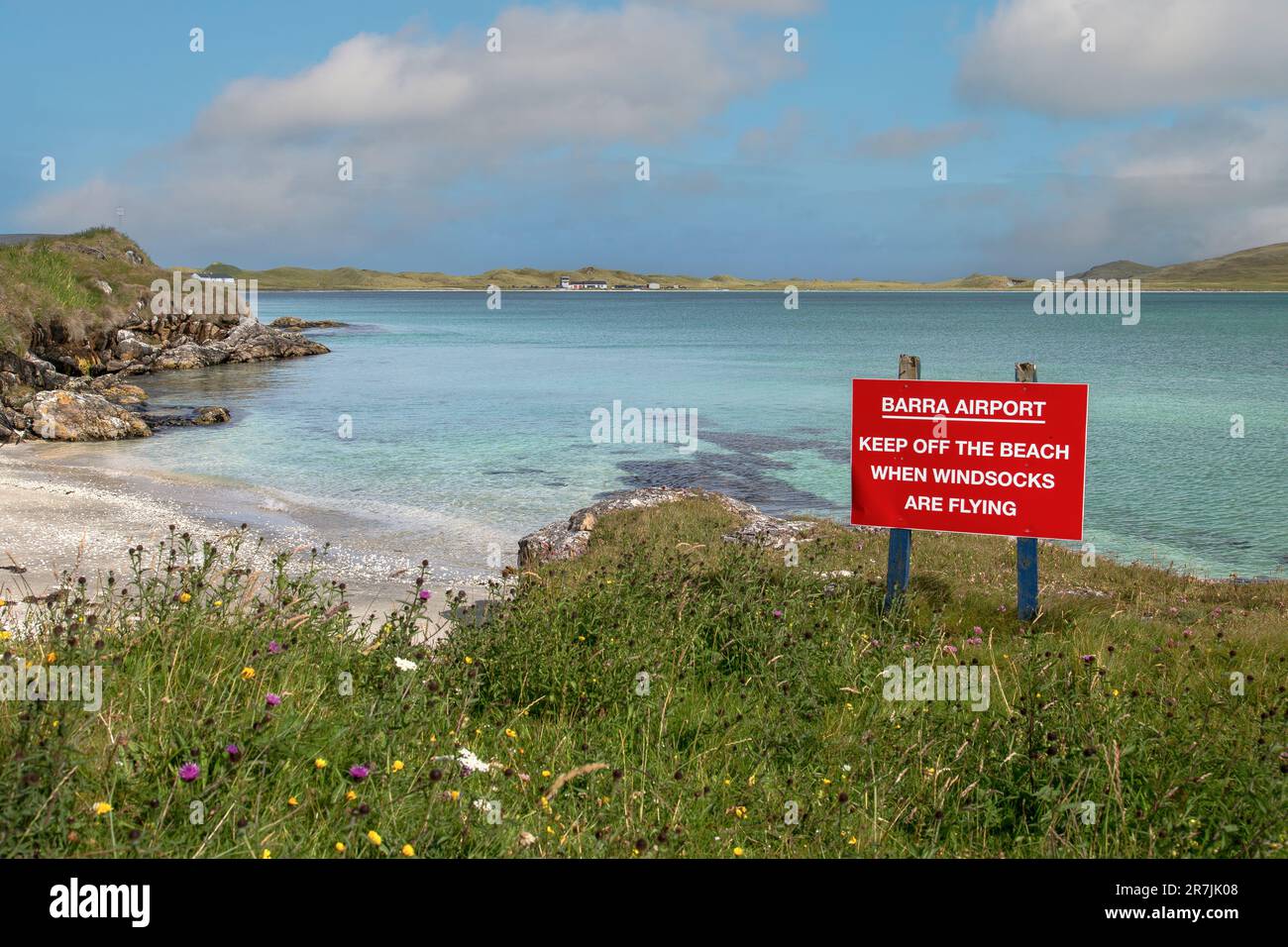 Red Warning Sign on Barra Airport on Traigh Mhor Beach at High Tide, Barra, Isle of Barra, Hebrides, Outer Hebrides, Scotland, United Kingdom Stock Photo