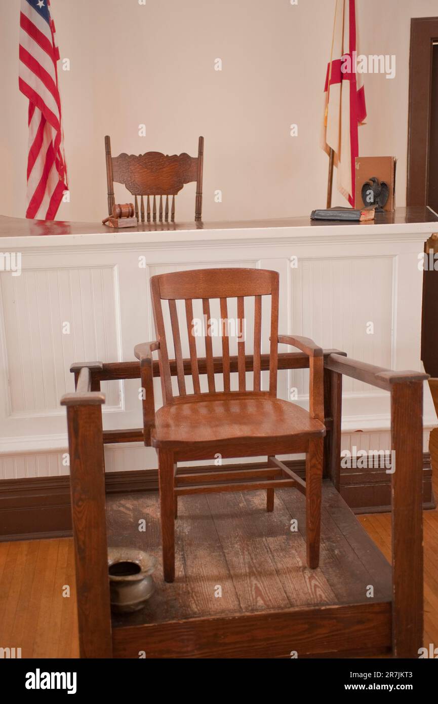 Interior of Monroeville, Alabama courthouse, now a museum showing judges bench and the witness