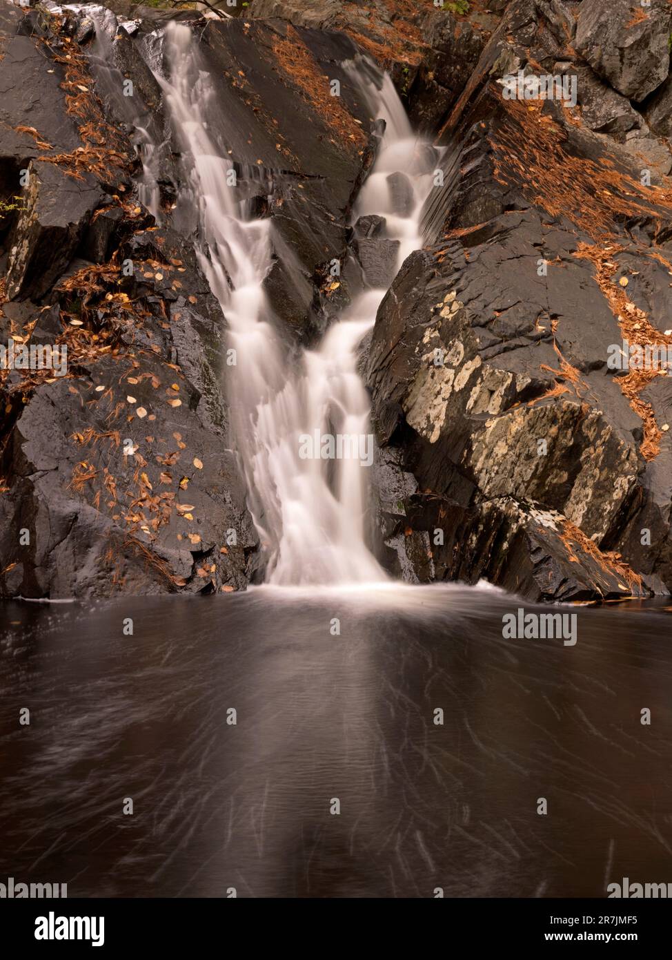 Waterfall at Poplar Stream drops over rock face in Carrabassett Valley