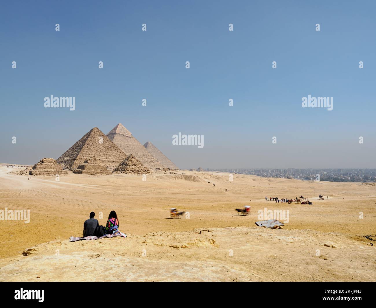 Exploring the Ancient Wonders of Egypt: Pyramids and Camels in t Stock Photo