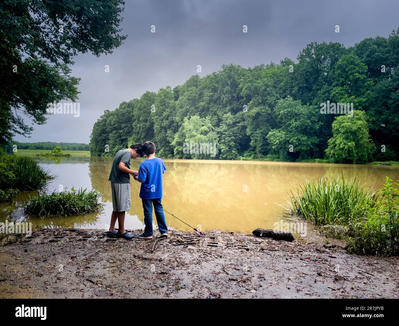 Kid fishing in river hi-res stock photography and images - Alamy