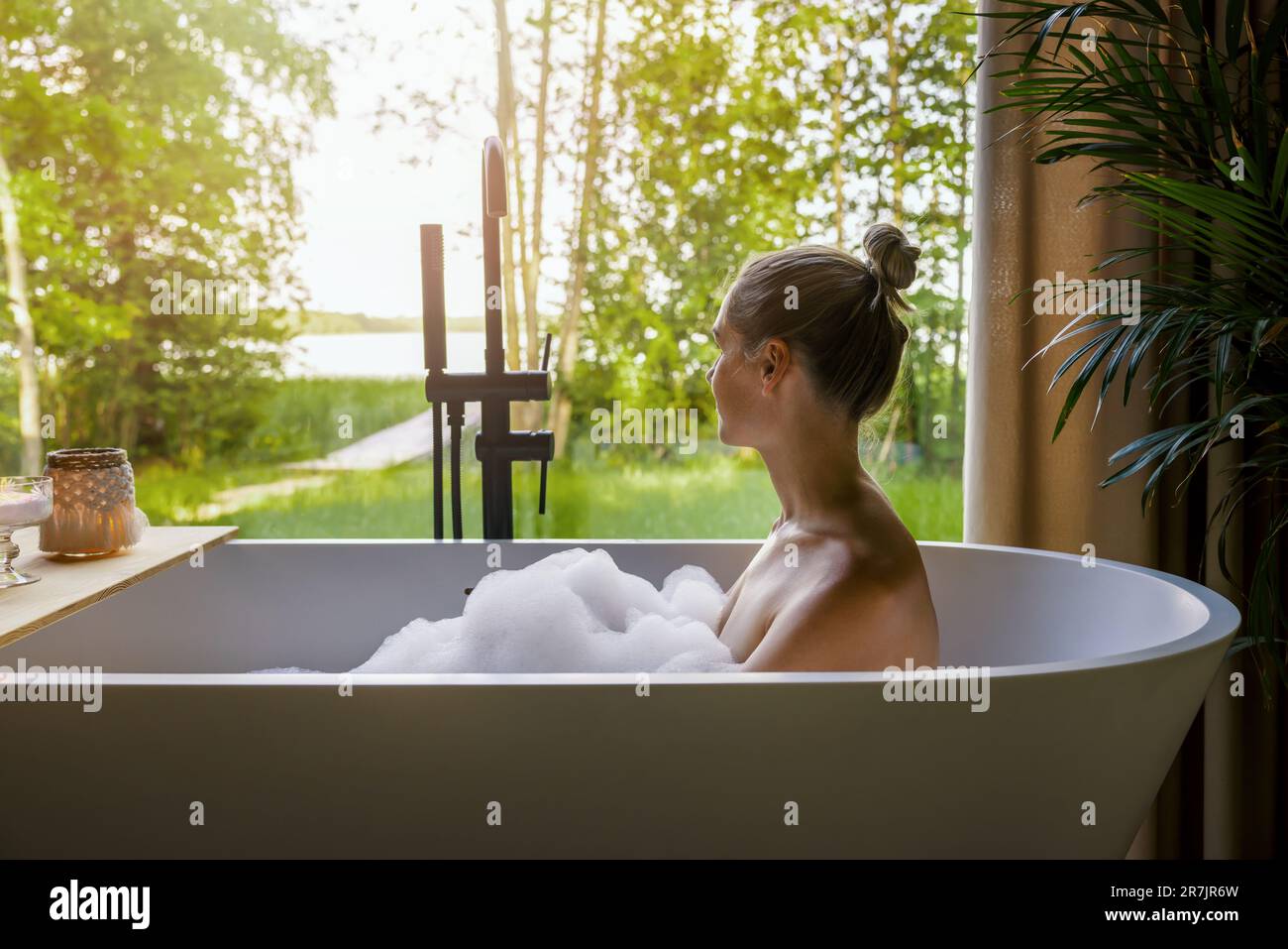 Relaxing woman in bathtub hi-res stock photography and images - Alamy