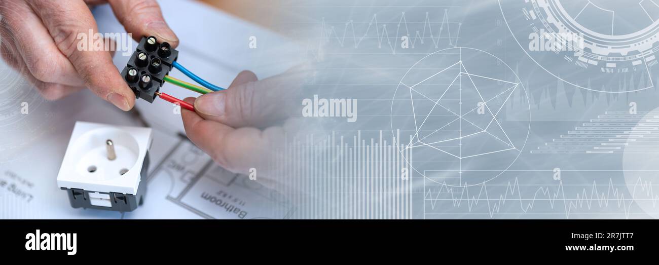 Electrician hands connecting wires in terminal block; panoramic banner Stock Photo