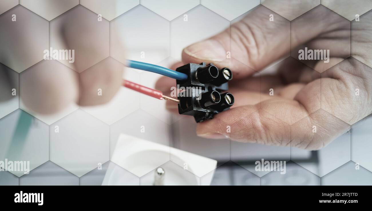 Electrician hands connecting wires in terminal block, geometric pattern Stock Photo