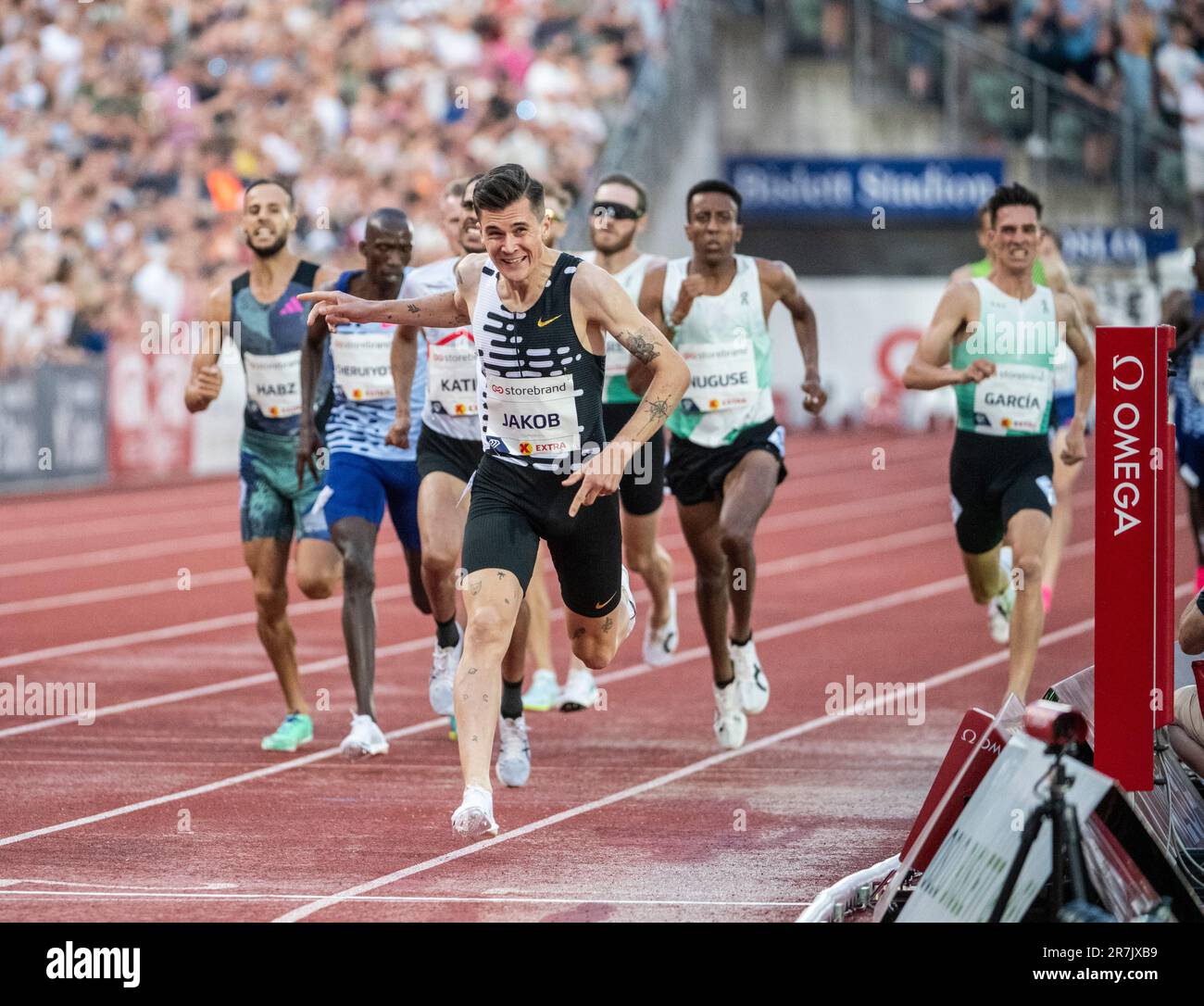 Jakob Ingebrigtsen of Norway crosses the finishing line to win the men