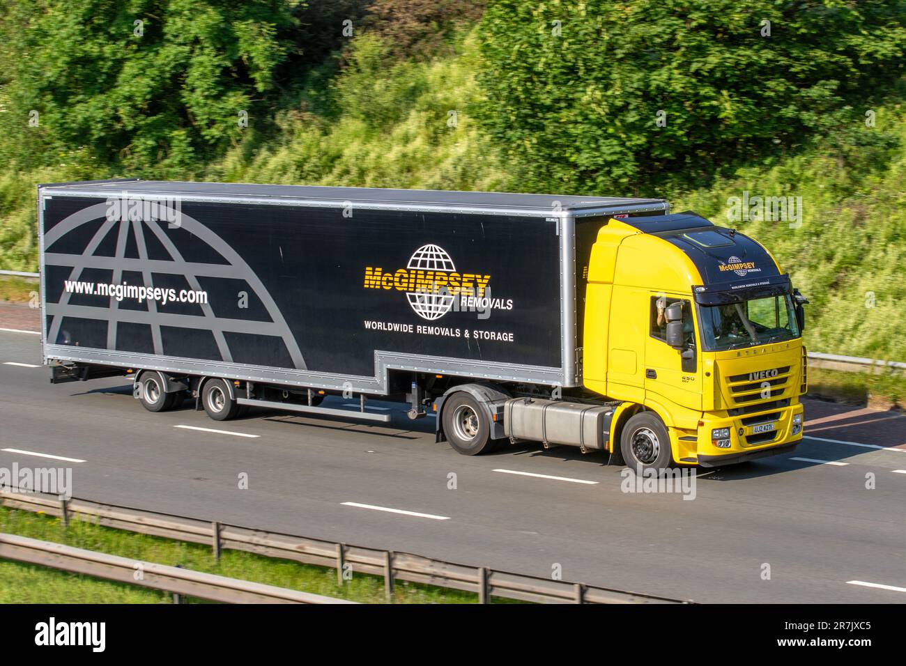 McGIMPSEY worldwide removals and storage 2013 IVECO  Diesel 10308 cc;  travelling on the M6 motorway, UK Stock Photo