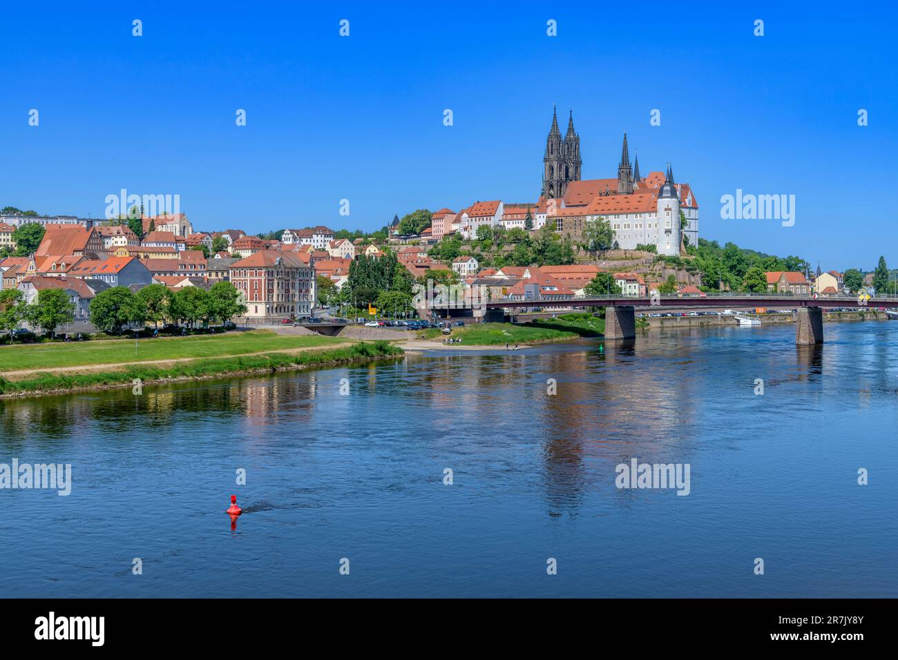 Iconic Meissen with Albrechtsburg Castle (Albrechtsburg Meissen) and Cathedral (Dom zu Meißen) high above the town reflecting in the river Elbe below. Stock Photo