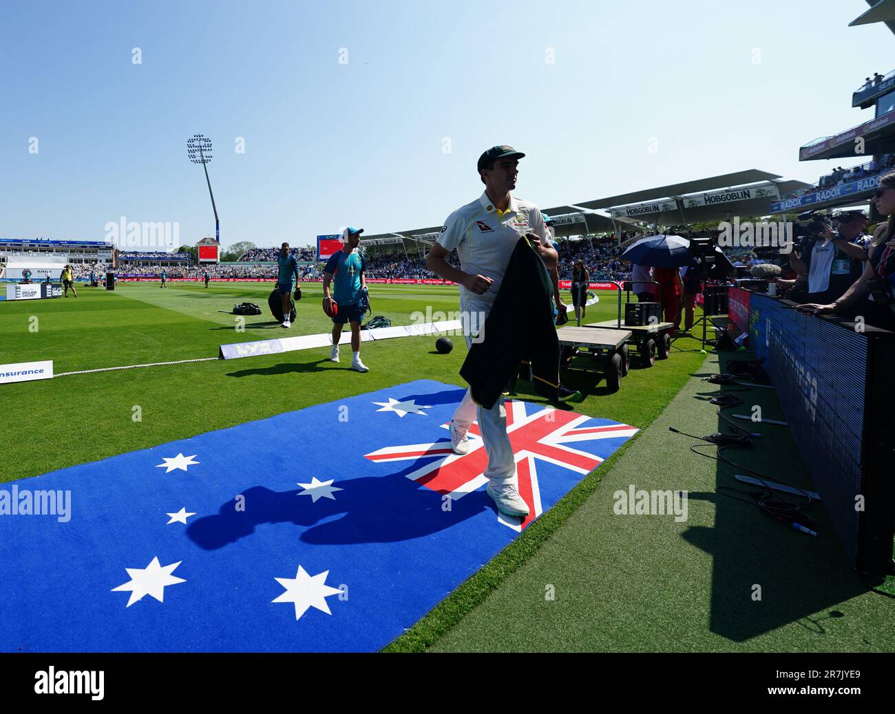 Australia's Pat Cummins walks over his country's flag ahead of day one of the first Ashes test match at Edgbaston, Birmingham. Picture date: Friday June 16, 2023. Stock Photo