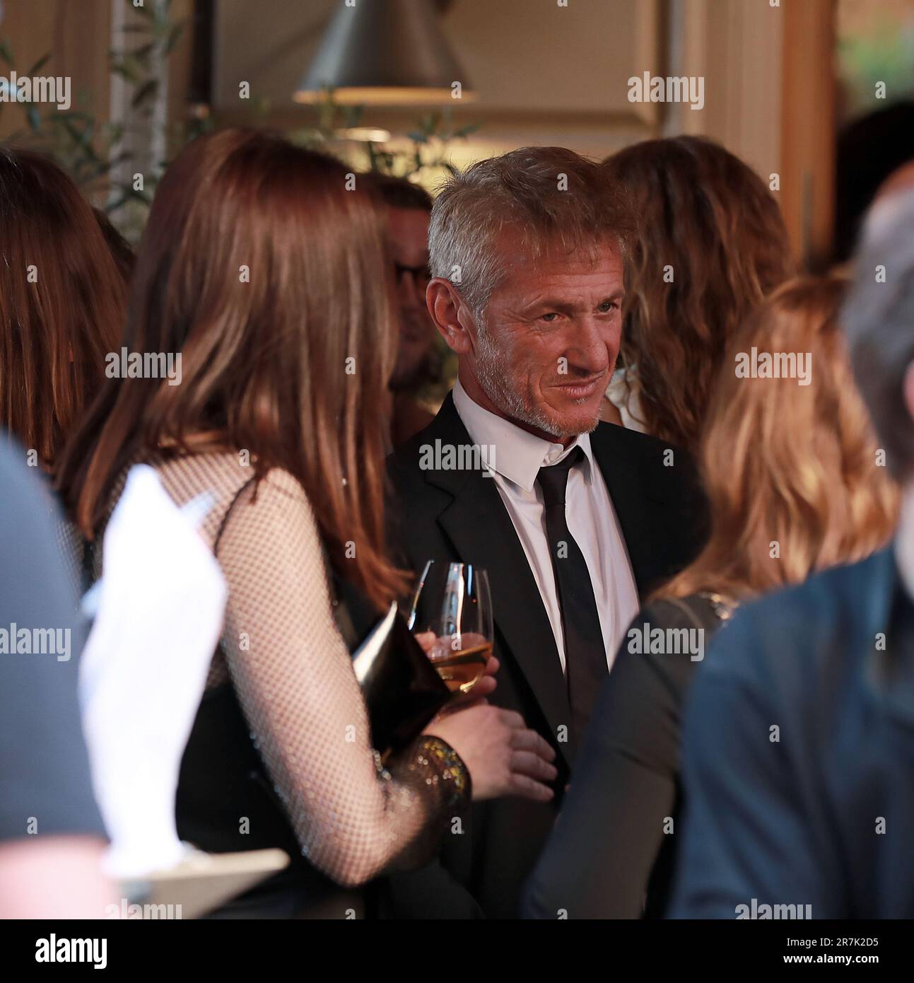 Sean Penn and his new girlfriend Olga Korotyayeva arrive at a party at