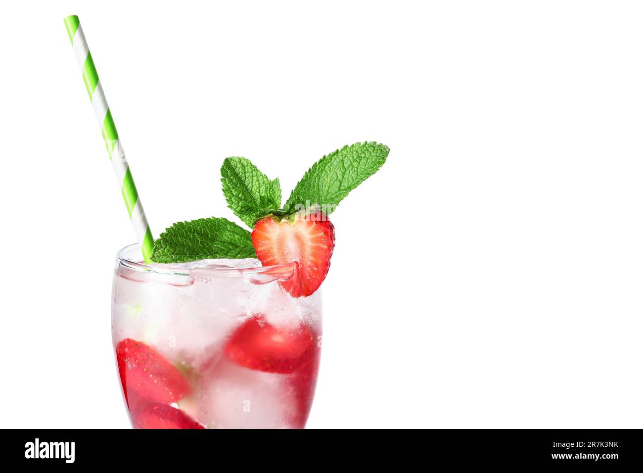 Glass of infused water with strawberry and mint on white background ...