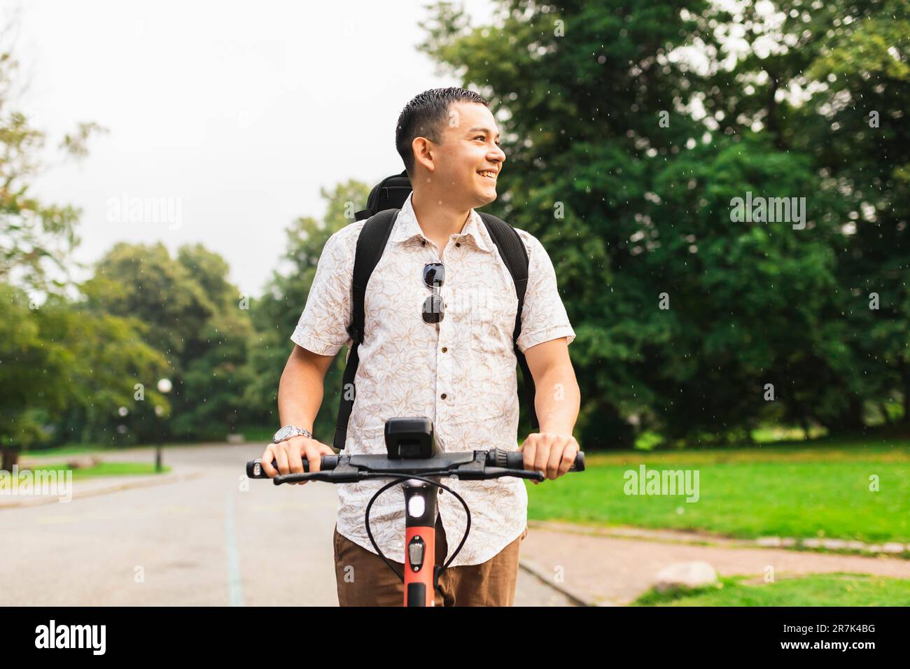 Man riding electric scooter hi-res stock photography and images - Alamy