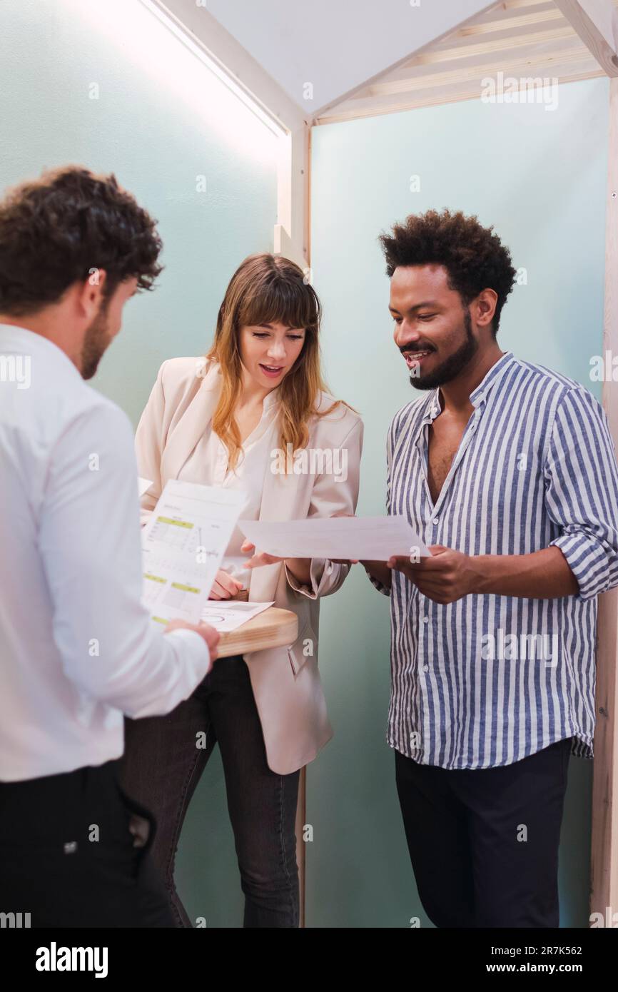 Business colleagues discussing document in office Stock Photo