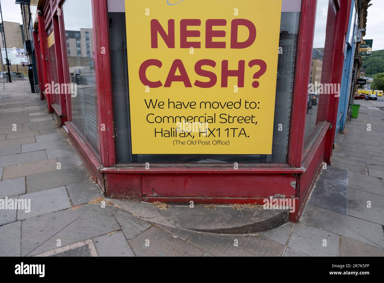 Closed down branch of Cash Converters displays a sign asking if anyone needs cash that their business has moved to a new location in the town centre on 6th June 2023 in Halifax, United Kingdom. Halifax is a town in the borough of Calderdale in West Yorkshire and was a thriving mill town, but things have been difficult for small businesses over the past years and especially now with the ongoing cost of living crisis and increasing financial pressures resulting in a fall in real incomes. This is caused in part by a rise in inflation in the UK, as well as the economic impact of foreign issues. Stock Photo