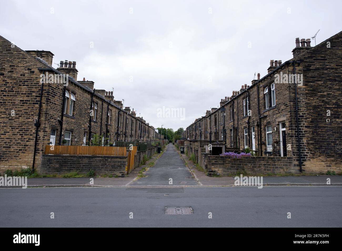 Back alley where bins are kept outside old mill workers cottages within