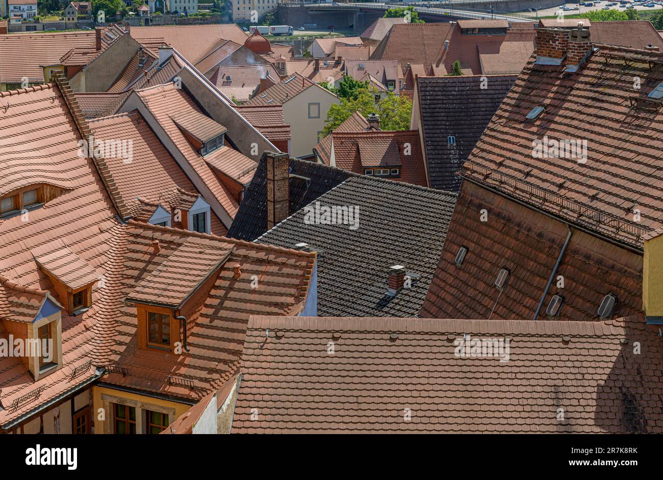 High over the rooftops of the beautiful town of Meissen near Dresden in Germany. Nearly all the roofs are the same perfect terracotta. Stock Photo