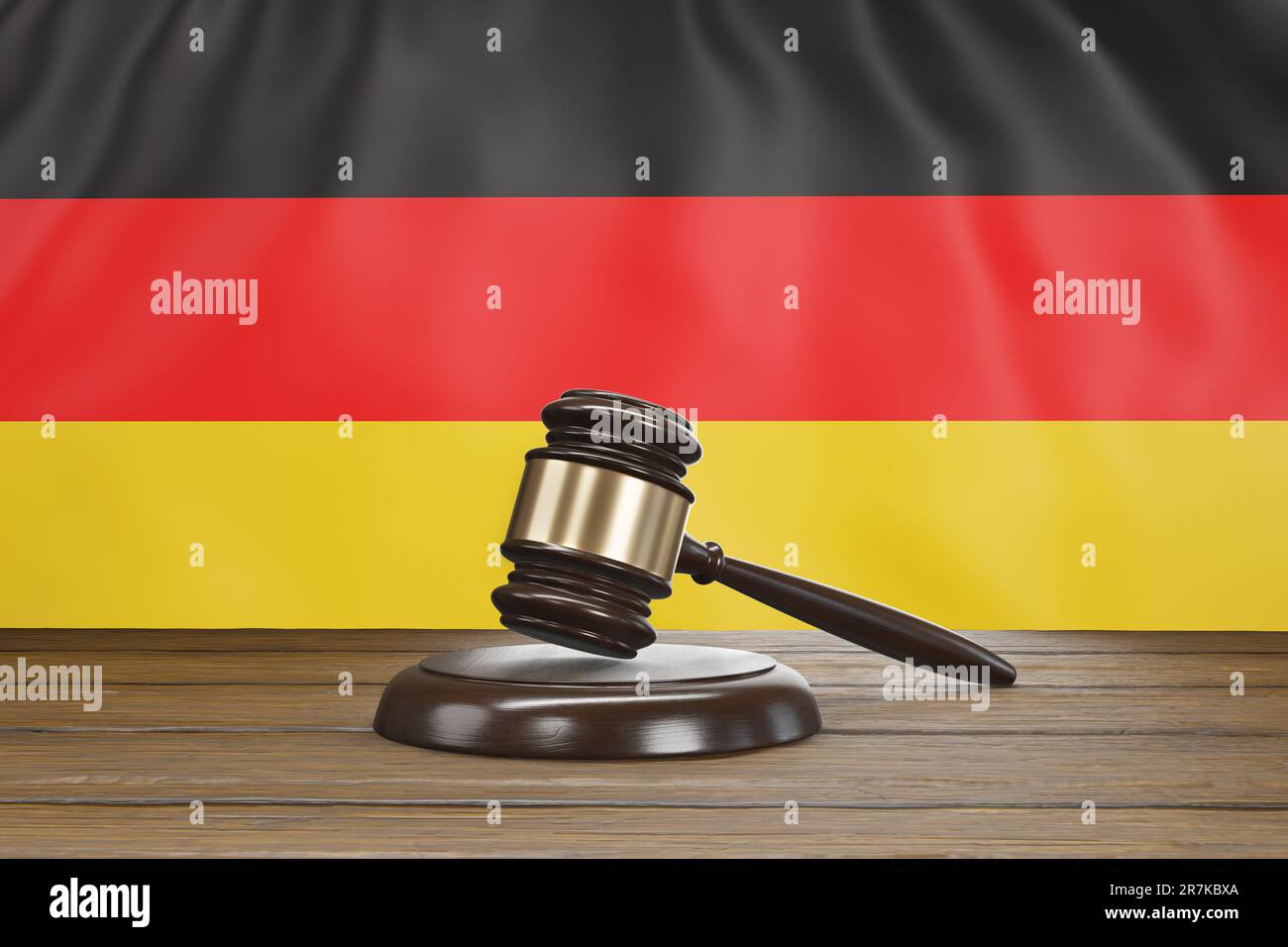 Small hammer gavel of judges of courts placed on a wooden table with national flag of Germany as background. German legal system and judicial issues Stock Photo