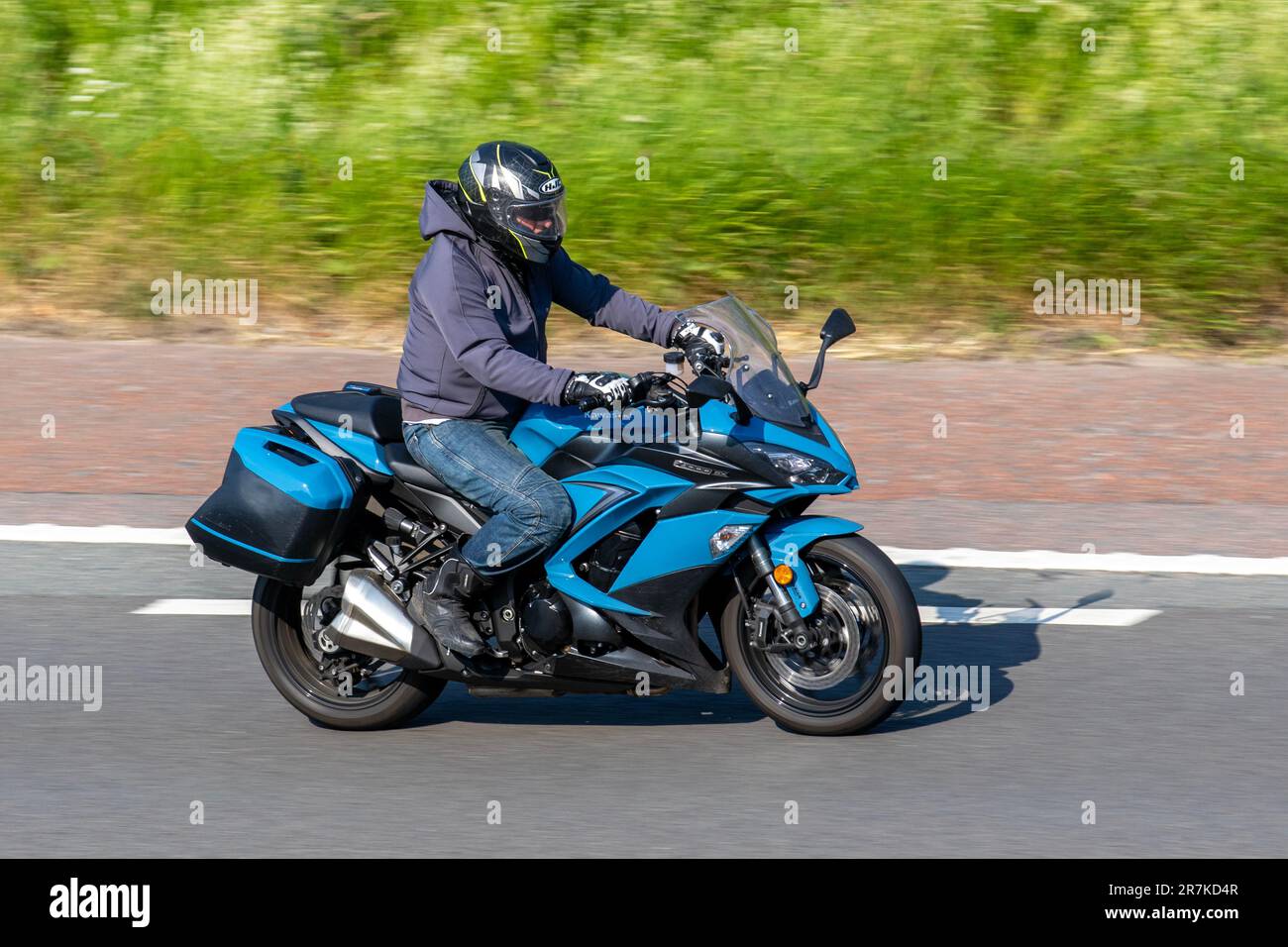 2019 Kawasaki Z1000SX in Stormcloud Blue; travelling on the M6 motorway in Greater Manchester, UK Stock Photo
