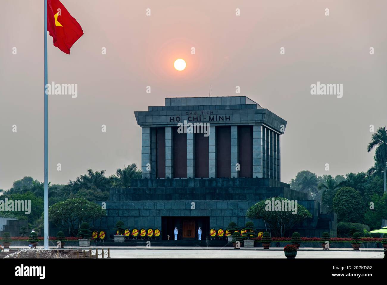 Hanoi, Vietnam-April 2023; View of the The President Ho Chi Minh Mausoleum in Ba Dinh Square with embalmed body of Ho Chi Minh and orange sun setting Stock Photo