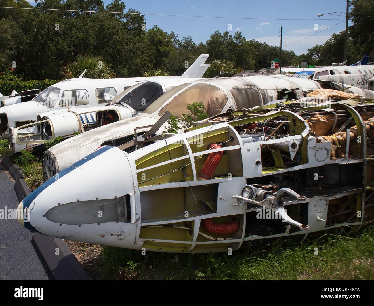 Airplane boneyard / scrapyard / junkyard with planes disassembled. Stock Photo