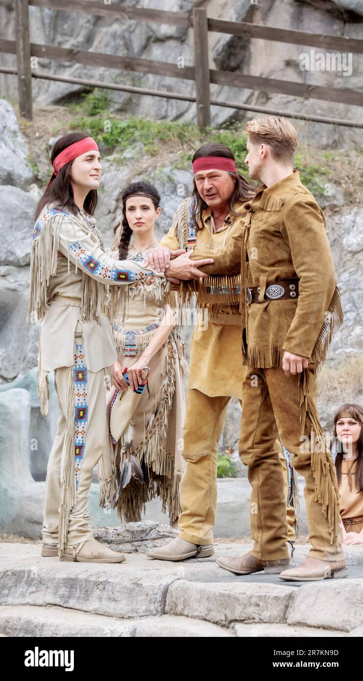 Bad Segeberg, Germany. 16th June, 2023. Actors (l-r) Alexander Klaws as Winnetou, Nadine Menz Nscho-tschi, Joshy Peters as Intschu-tschuna and Bastian Semm as Old Shatterhand perform at the photo rehearsal for the new production of the Karl May Games 'Winnetou I - Blood Brothers'. The play celebrates its premiere on June 24 at the open-air theater at Kalkberg. Credit: Markus Scholz/dpa/Alamy Live News Stock Photo