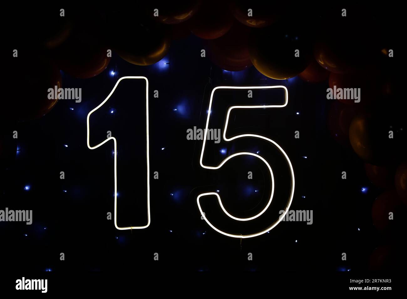 number fifteen with lights at 15th birthday party - front view - light party Stock Photo