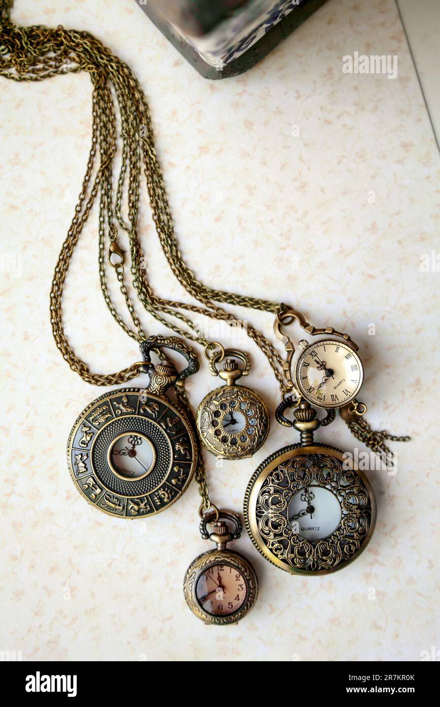 Collection of old vintage pocket watches at a flea market. Many antique chain watches in an antique store - Stock Image