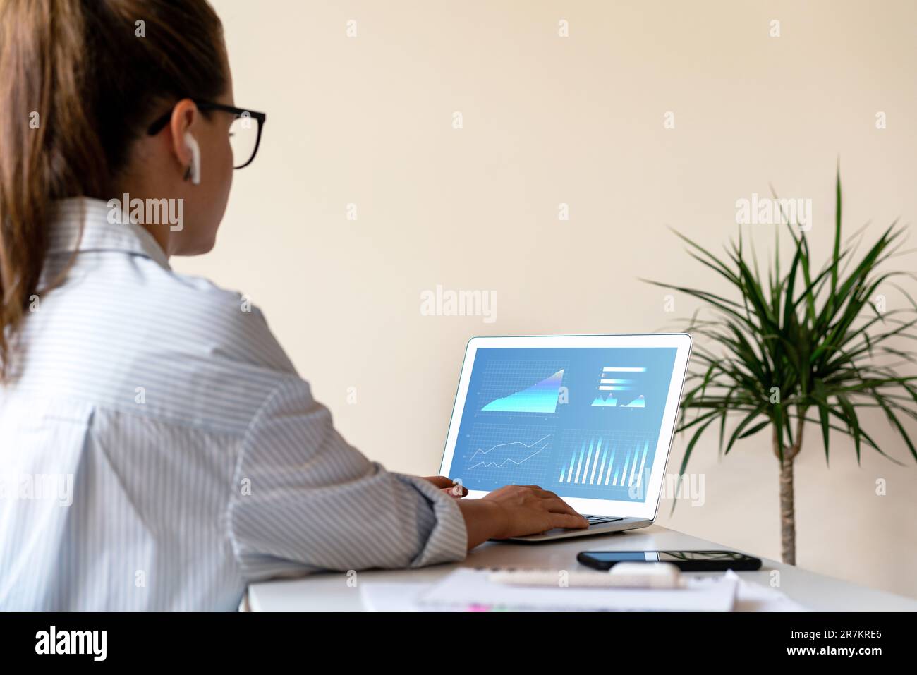 Sales manager woman analysing commercial kpis, graphs and charts of business performance on laptop screen. Stock Photo