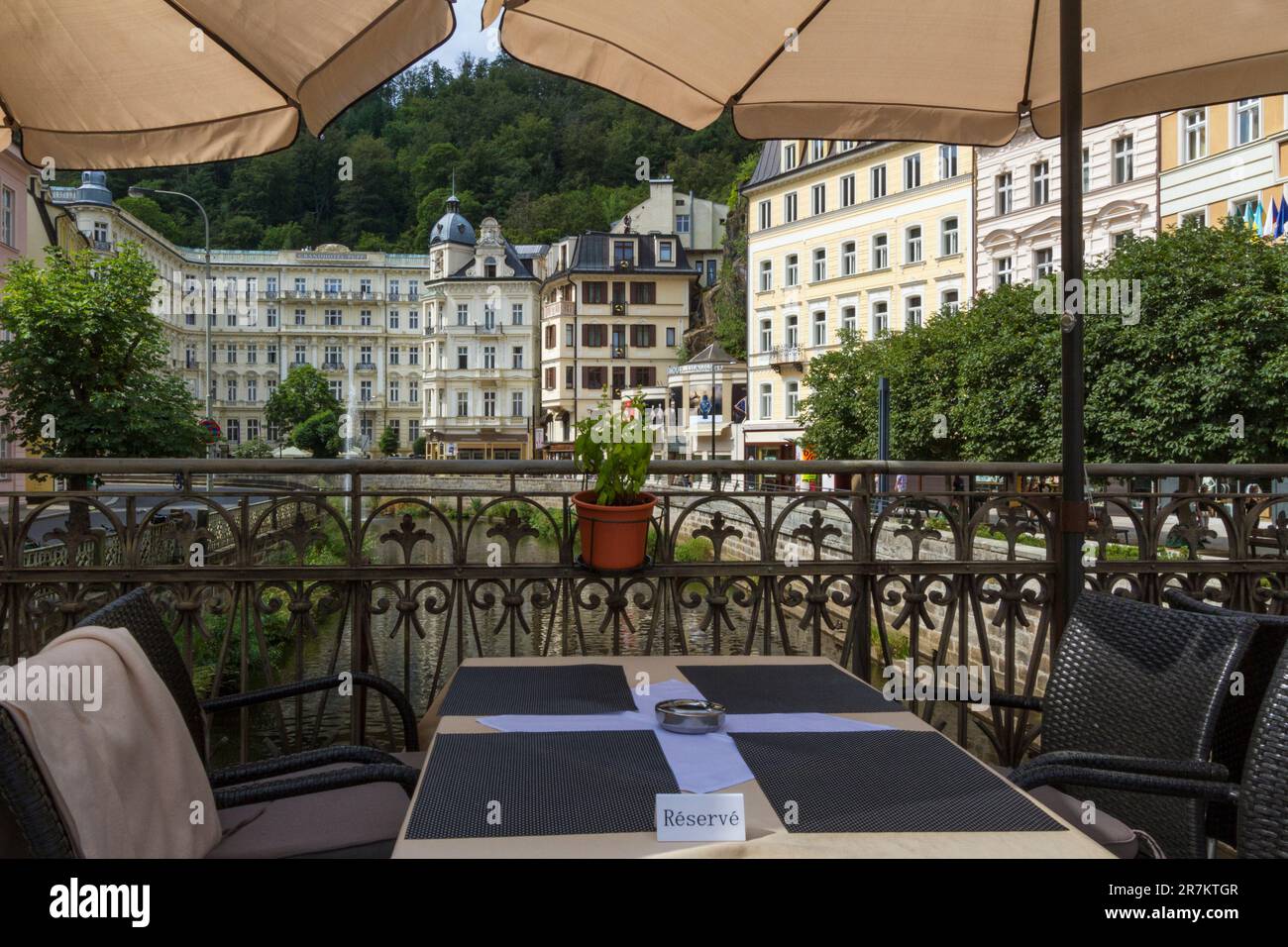 Grandhotel Pupp seen from a restaurant table on river Tepla in Karlovy Vary Stock Photo