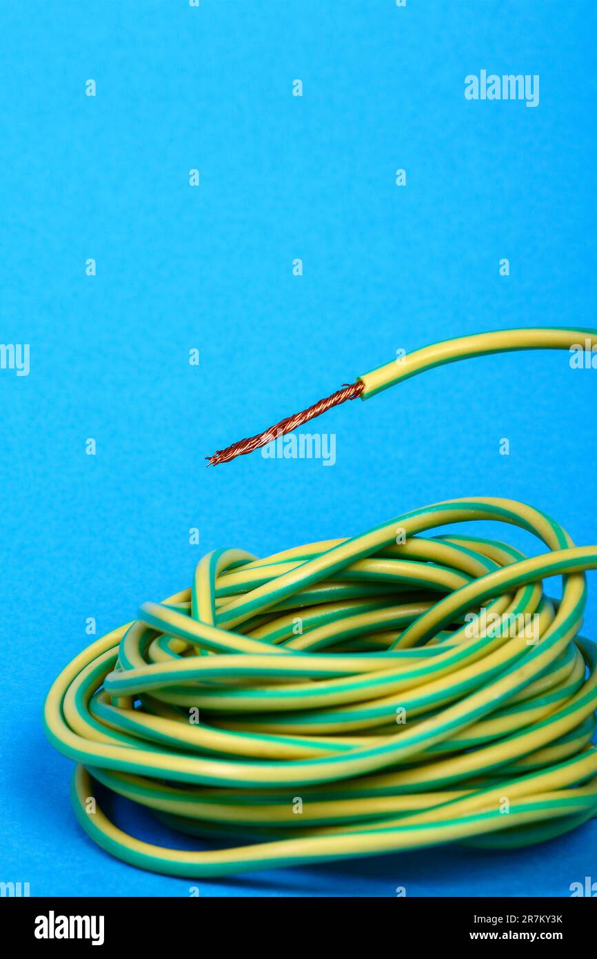 Coil of green and yellow electrical earth wire Stock Photo Alamy