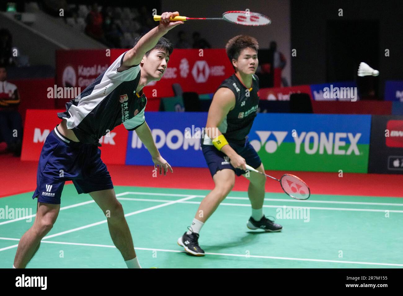 Chinas Wang Chang, left, with Liang Wei Keng play against Indonesias Pramudya Kusumawardana and Yeremia Rambitan during their mens dobles quarter final match at Indonesia Open badminton tournament at Istora Stadium in