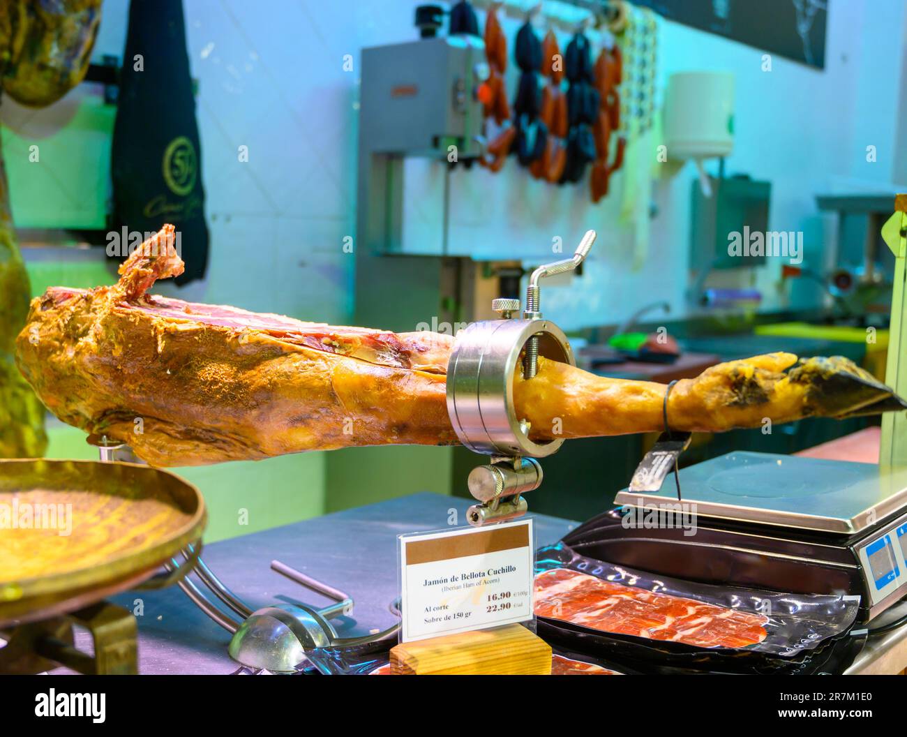 Leg of pork serrano Iberian cured jamon on stand in Spanish butcher's